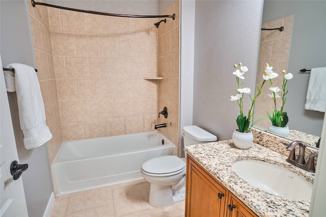 full bathroom featuring tile patterned floors, vanity, tiled shower / bath combo, and toilet