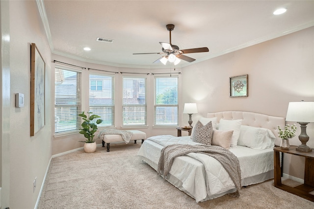 bedroom featuring light carpet, ceiling fan, and ornamental molding