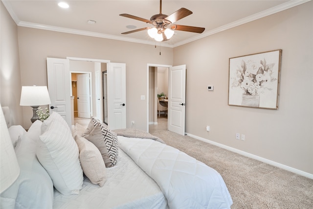 carpeted bedroom featuring ceiling fan and ornamental molding