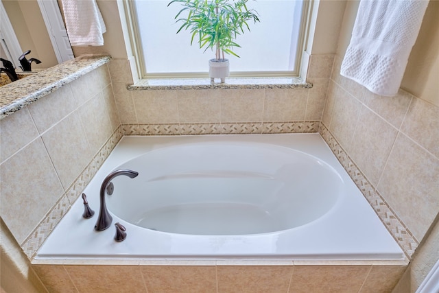 bathroom featuring a relaxing tiled tub