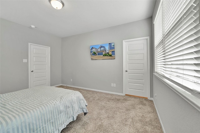 bedroom with light carpet