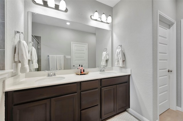 bathroom featuring vanity and an enclosed shower