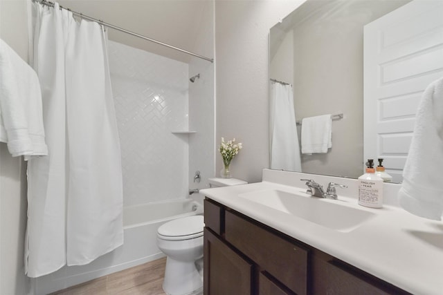 full bathroom with toilet, shower / tub combo with curtain, vanity, and hardwood / wood-style flooring