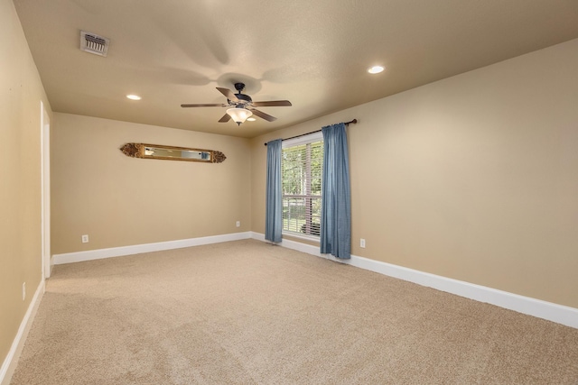 unfurnished room featuring carpet flooring and ceiling fan