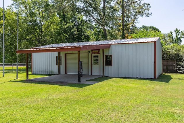 view of outdoor structure featuring a lawn