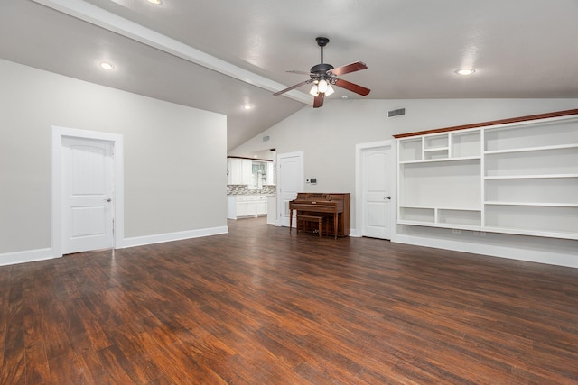 unfurnished living room featuring vaulted ceiling with beams, dark hardwood / wood-style floors, and ceiling fan