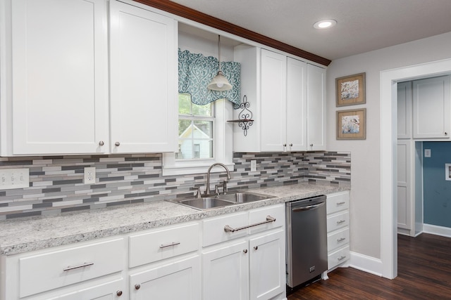 kitchen featuring dark hardwood / wood-style flooring, backsplash, sink, decorative light fixtures, and dishwasher