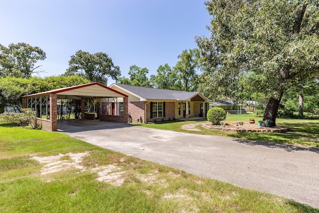 ranch-style house with a front lawn and a carport