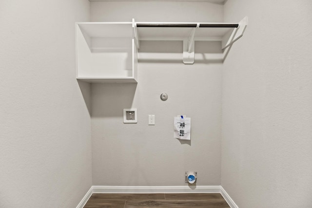 clothes washing area featuring washer hookup, gas dryer hookup, and dark wood-type flooring