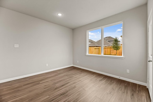 empty room with wood-type flooring