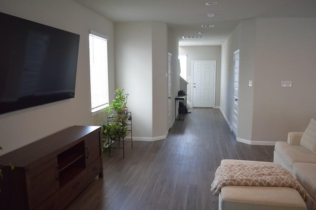 hallway featuring dark hardwood / wood-style flooring