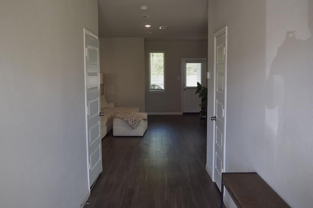 hall with dark hardwood / wood-style floors