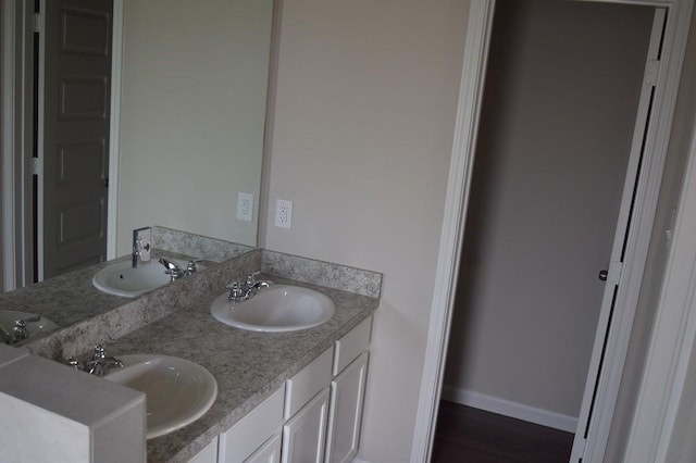 bathroom with wood-type flooring and vanity