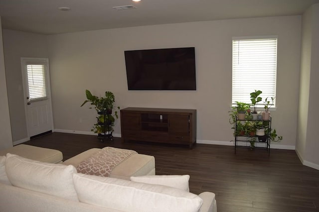 living room featuring dark hardwood / wood-style floors