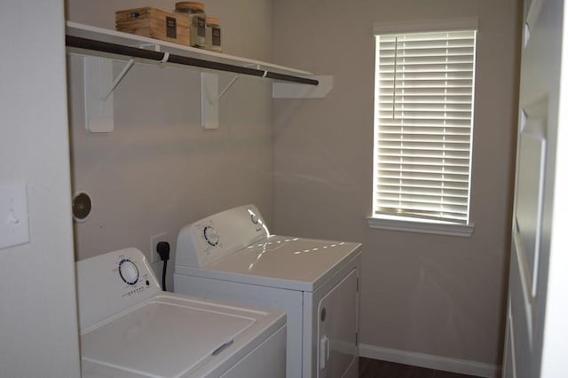 washroom with washing machine and dryer