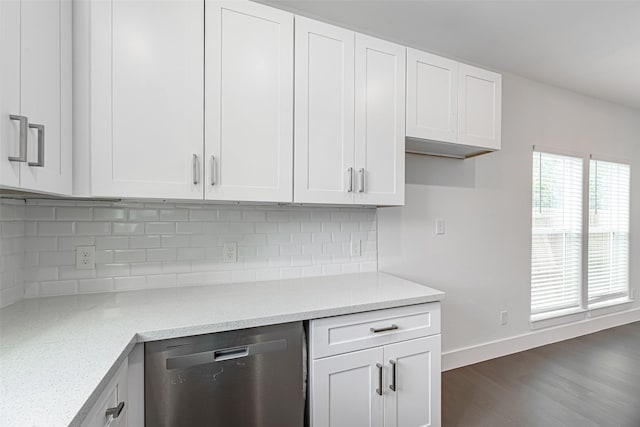 8211 Gladstone St, Houston, TX 77051 - kitchen with dishwasher, white cabinets, and backsplash