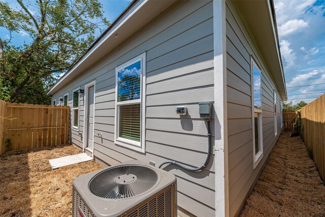 8211 Gladstone St, Houston, TX 77051 - view of property exterior featuring a cooling unit and a fenced backyard