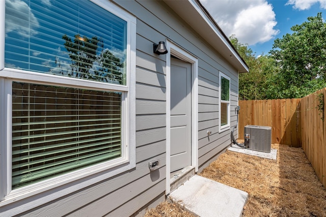 view of side of property with central AC unit