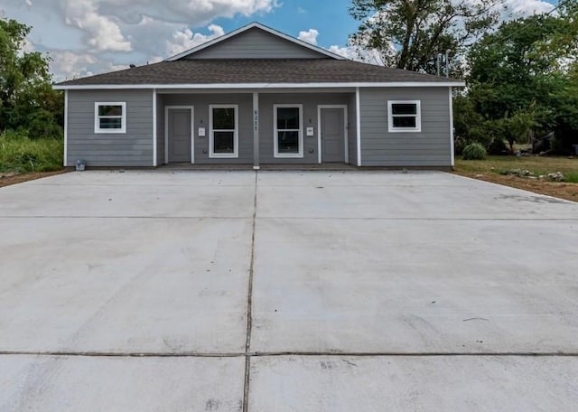 8211 Gladstone St, Houston, TX 77051 - view of front facade featuring a shingled roof, covered porch, and driveway