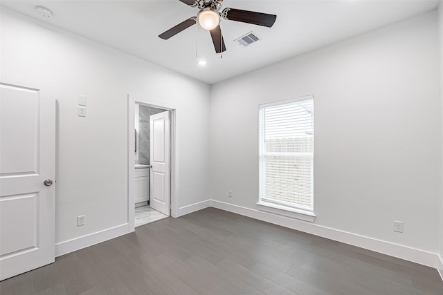 8211 Gladstone St, Houston, TX 77051 - unfurnished bedroom featuring dark wood-type flooring, recessed lighting, ensuite bath, and ceiling fan