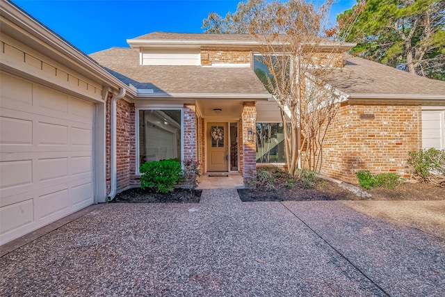 entrance to property featuring a garage