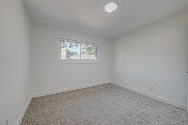 unfurnished room featuring carpet flooring