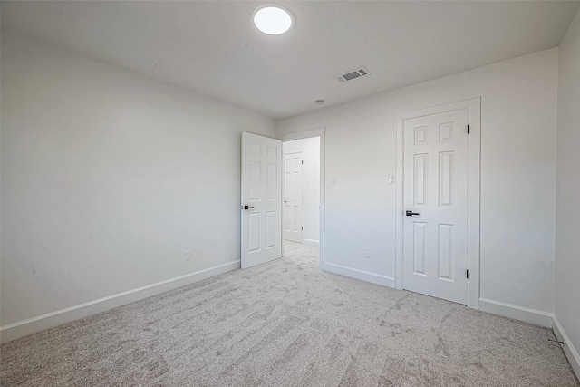 unfurnished bedroom with carpet and a closet