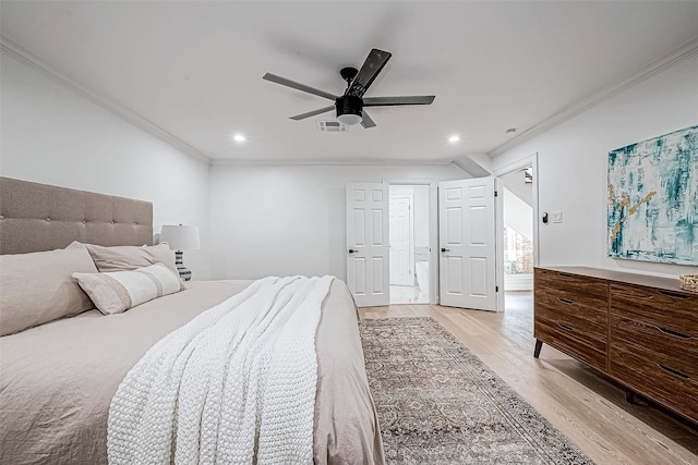 bedroom featuring light hardwood / wood-style floors, ceiling fan, and ornamental molding