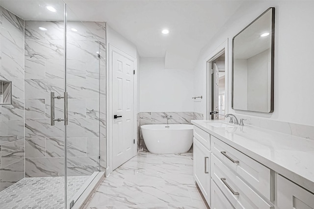 bathroom with plus walk in shower, vanity, and tile walls