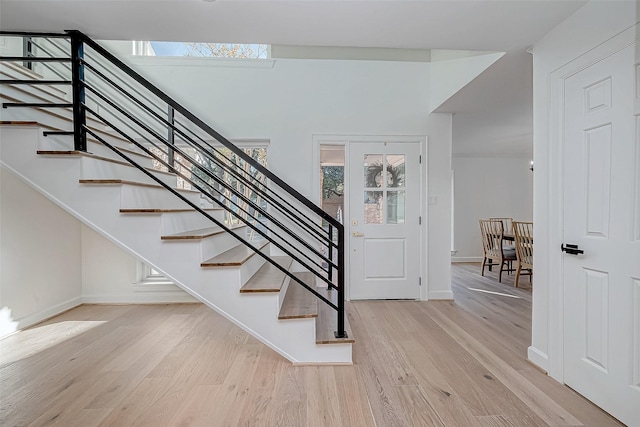 stairway featuring wood-type flooring