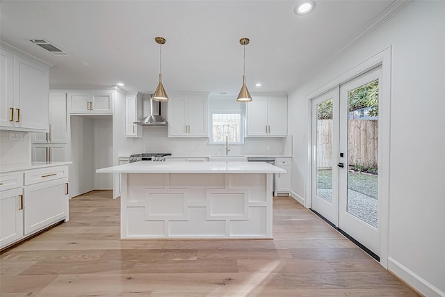 kitchen with white cabinets, sink, and french doors