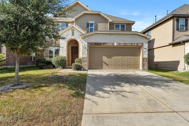 view of front of home with a front yard and a garage