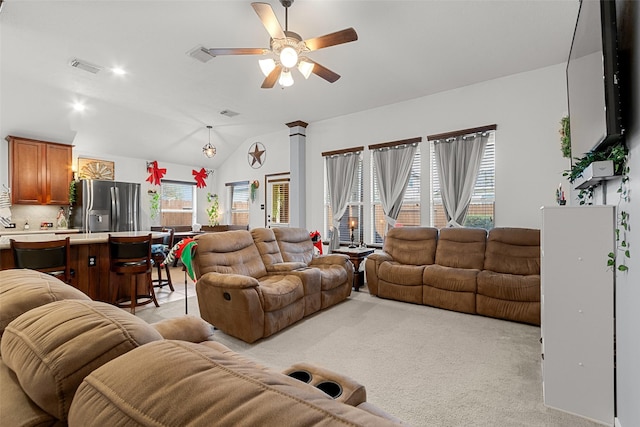 carpeted living room featuring ceiling fan and lofted ceiling