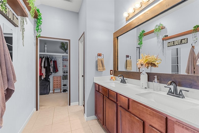 bathroom with tile patterned floors and vanity