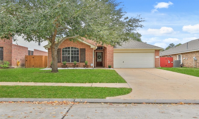 view of front of home featuring cooling unit, a front lawn, and a garage