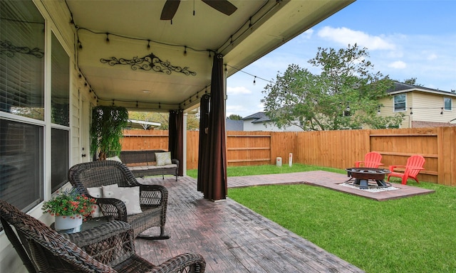 view of patio / terrace featuring an outdoor fire pit and ceiling fan