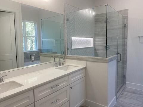 bathroom with vanity and an enclosed shower