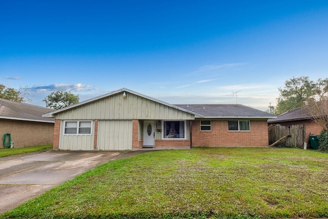 ranch-style home with a front lawn