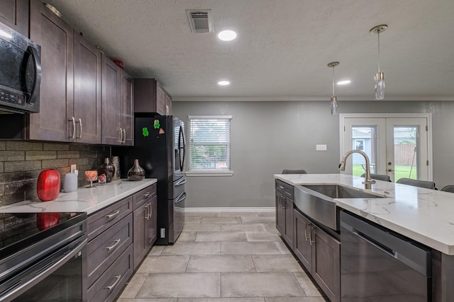 kitchen featuring french doors, sink, hanging light fixtures, tasteful backsplash, and stainless steel appliances