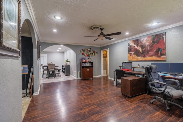 2007 Flynn Dr, Pasadena, TX 77502 - home office with arched walkways, a textured ceiling, ornamental molding, ceiling fan, and wood finished floors
