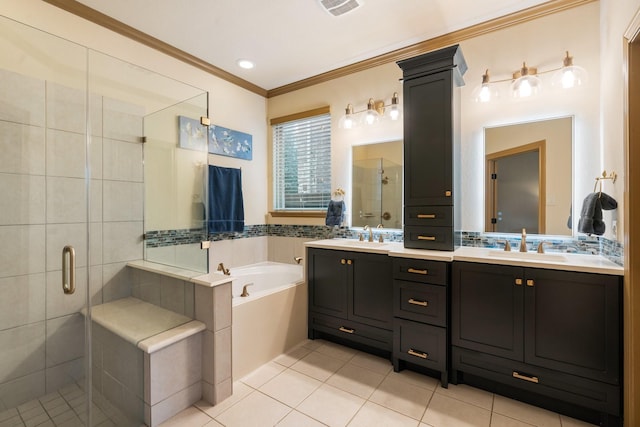 bathroom featuring plus walk in shower, vanity, tile patterned flooring, and crown molding