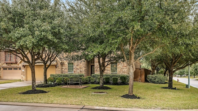 view of front of house with a garage and a front yard