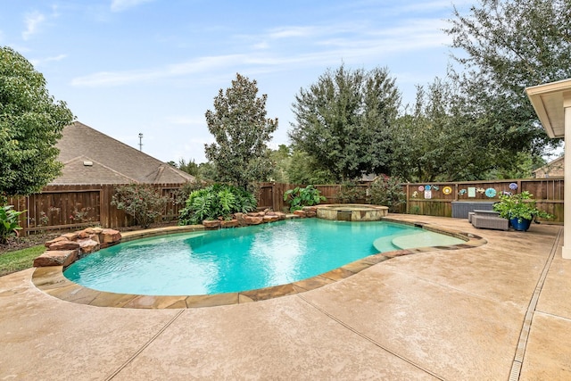 view of pool with an in ground hot tub and a patio