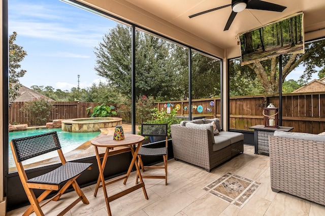 sunroom / solarium featuring ceiling fan