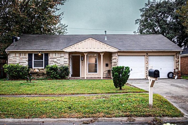 ranch-style home featuring a garage and a front yard