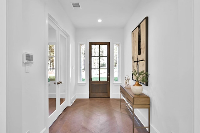 foyer featuring dark parquet floors