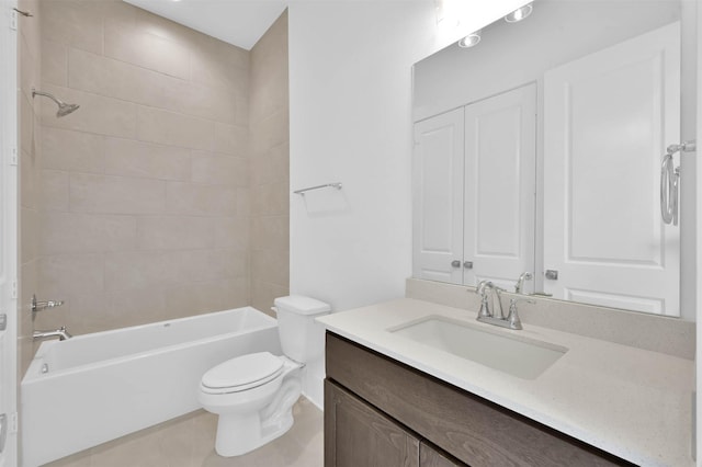 full bathroom featuring tile patterned flooring, vanity, toilet, and tiled shower / bath