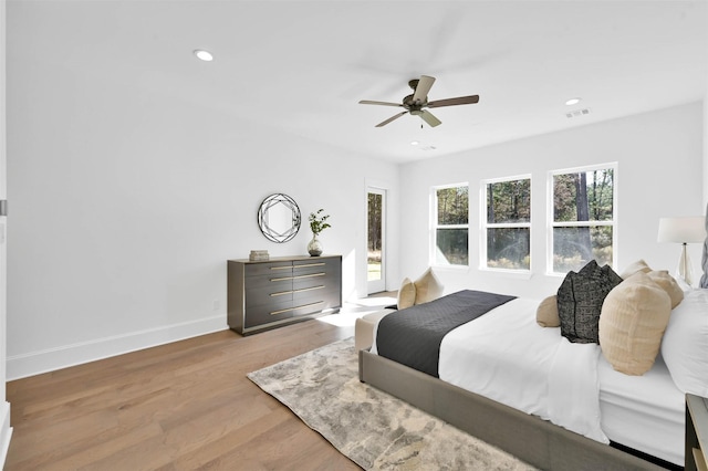 bedroom featuring light wood-type flooring and ceiling fan