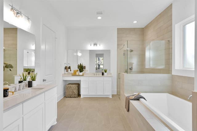 bathroom featuring tile patterned flooring, vanity, and independent shower and bath