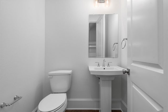 bathroom featuring toilet